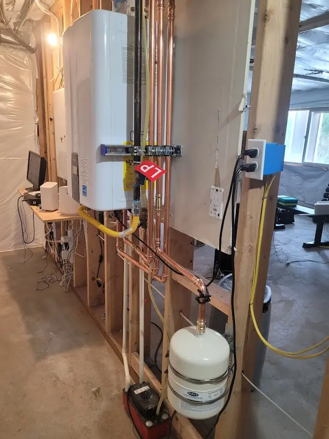 Licensed plumber repairing a kitchen sink in Progress Village