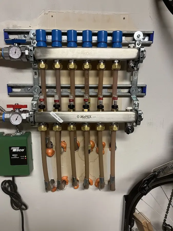 Plumber performing Water Heater Repair at a residential property in Progress Village